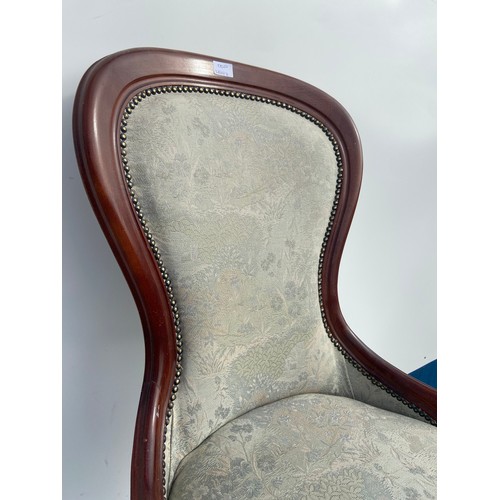 333 - A REPRODUCTION SPOON BACK ARMCHAIR