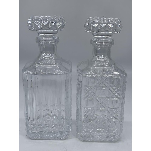 156 - 2 CUT GLASS DECANTERS WITH STOPPER 10