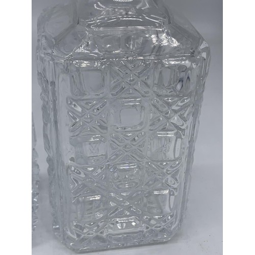 156 - 2 CUT GLASS DECANTERS WITH STOPPER 10