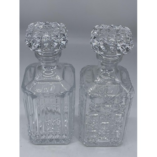 156 - 2 CUT GLASS DECANTERS WITH STOPPER 10