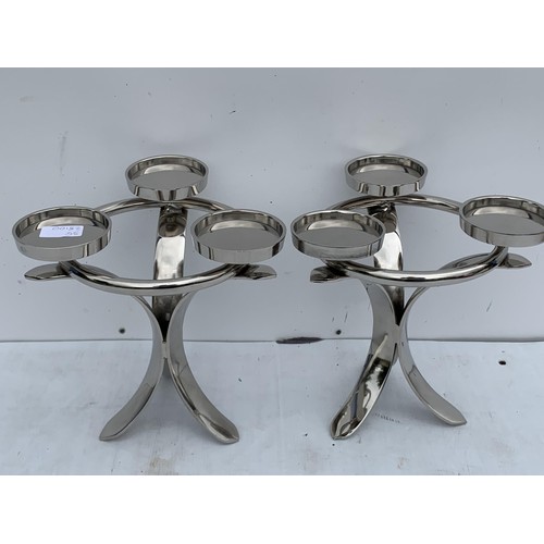 162 - A PAIR OF NEW CHROME CANDLE HOLDERS