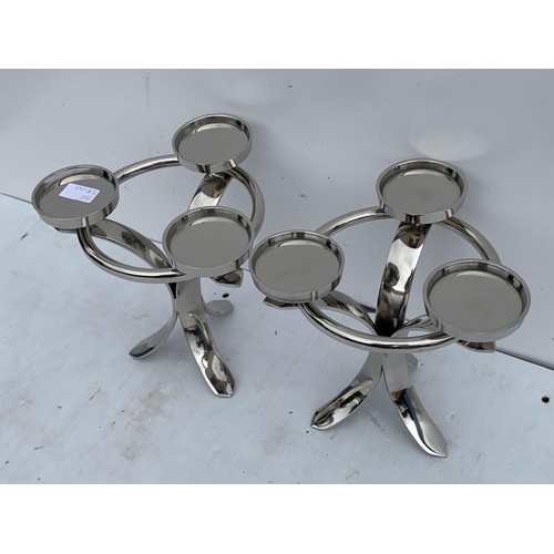 162 - A PAIR OF NEW CHROME CANDLE HOLDERS