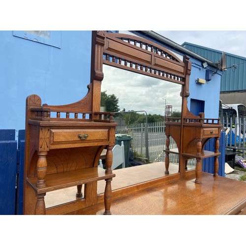 328 - AN ANTIQUE OAK MIRRORED BACKED SIDEBOARD