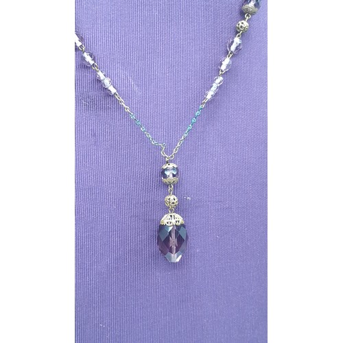 197 - AN AMETHST AND CRYSTAL SET PENDANT ON GILT CHAIN