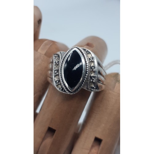 242 - A SILVER MARCASITE AND BLACKSTONE RING