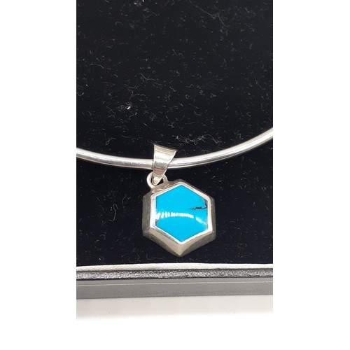 285 - A BOXED DESIGNER COLLAR NECKLACE IN SILVER WITH TURQUOISE PENDANT BOXED