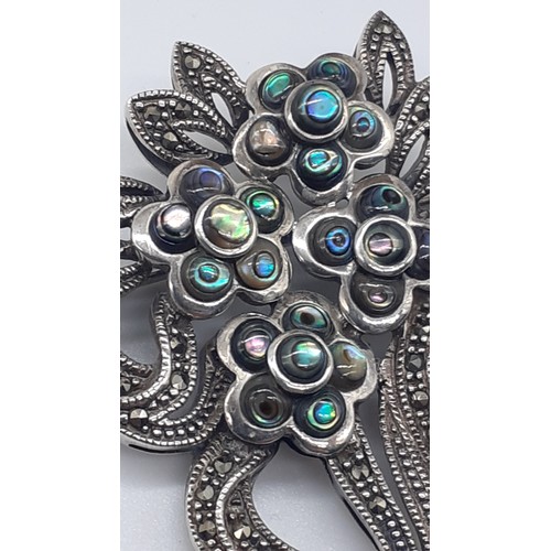 252 - A VINTAGE SILVER MARCASITE AND M.O.P FLORAL BROOCH