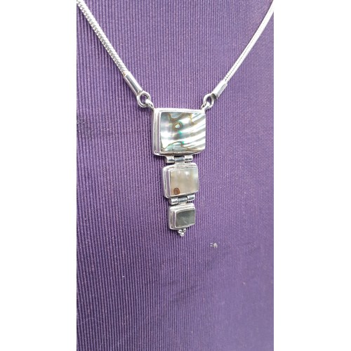 219 - A  MOP & SILVER PENDANT ON SILVER CHAIN