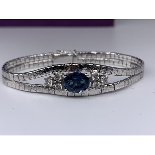 339 - A SAPPHIRE AND CRYSTAL WHITE METAL BRACELET