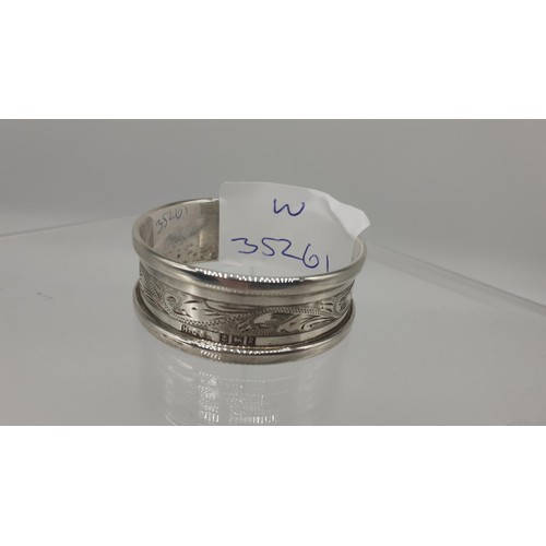 344 - A 1966 BIRMINGHAM ENGRAVED NAPKIN RING 11.8GRMS