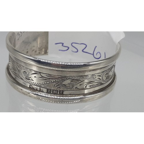 344 - A 1966 BIRMINGHAM ENGRAVED NAPKIN RING 11.8GRMS