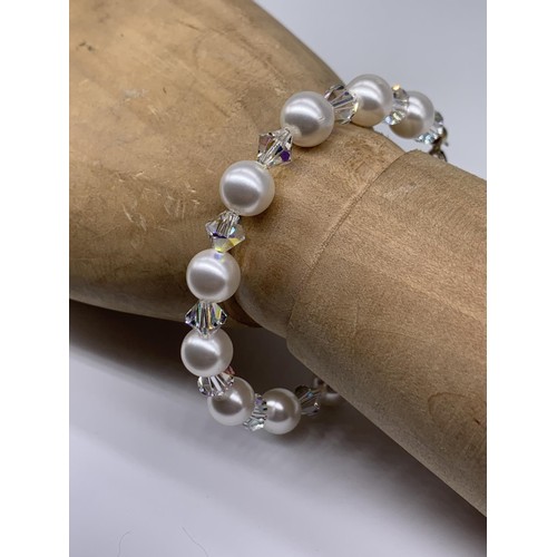 352 - A SILVER FITTING CRYSTAL AND PEARL BRACELET