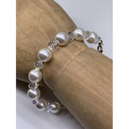 352 - A SILVER FITTING CRYSTAL AND PEARL BRACELET