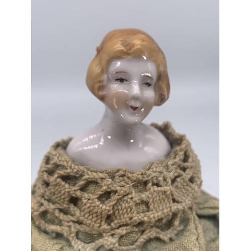 376 - A PORCELAIN HEAD DOLL IN AN IRISH LINEN DRESS 5