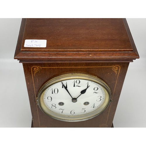 50 - AN INLAID MAHOGANY MANTLE CLOCK