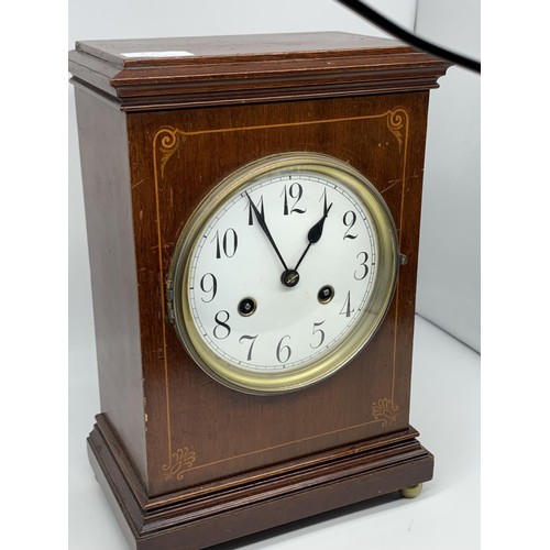 50 - AN INLAID MAHOGANY MANTLE CLOCK