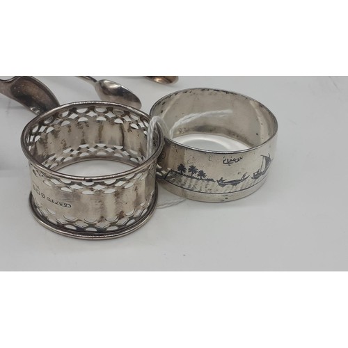 612 - 2 SILVER NAPKIN RINGS (1 SIGNED) 2 X SILVER IMPPLEMENTS AND EP SUGAR TONGS