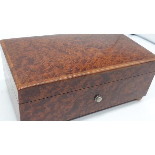 630 - AN AMBOYNA CASED MUSICAL BOX (PWO) 7 X 4 X 3IN