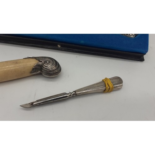 496 - A SILVER HANDLED CAKESLICE BOXED A SILVER MOUNTED UMBRELLA HANDLE & 2 SILVER HANDLED MANICURE ITEMS