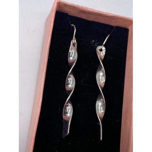 641 - LARGE SILVER DESIGNER STYLE TWIST EARRINGS