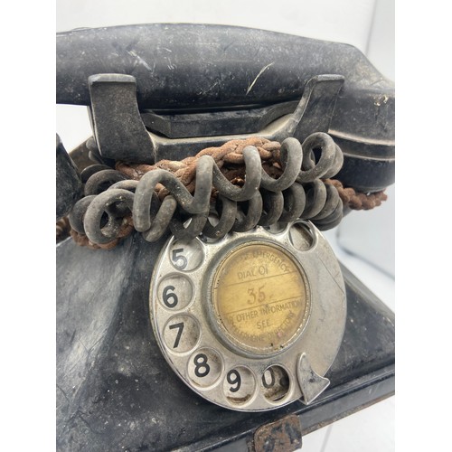 544 - AN OLD TELEPHONE (TEL NO 35) ON CAST BRACKET