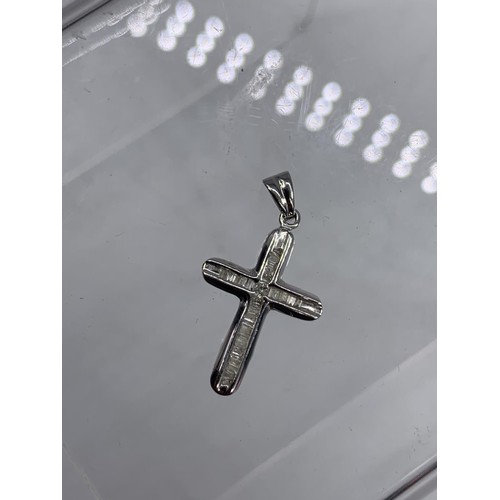 667 - 14CT WHITE GOLD DIAMOND SET CROSS 1.8G