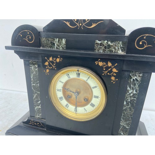 559 - A BLACK POLISHED SLATE MANTLE CLOCK WITH GREEN  POLISHED INLAY AND A PORCELAIN DIAL 14X14