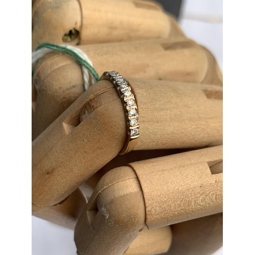 671 - FINE BAND ETERNITY RING SET WITH DIAMONDS IN 18CT YELLOW GOLD