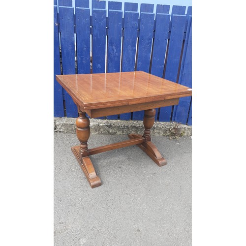 563 - A SMALL OAK DRAW LEAF TABLE