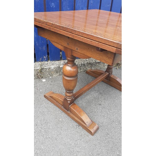 563 - A SMALL OAK DRAW LEAF TABLE