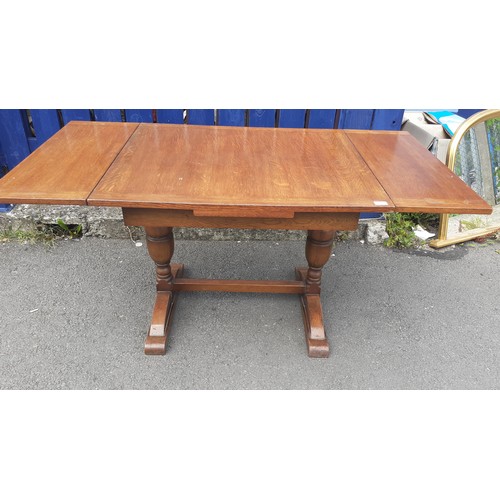 563 - A SMALL OAK DRAW LEAF TABLE