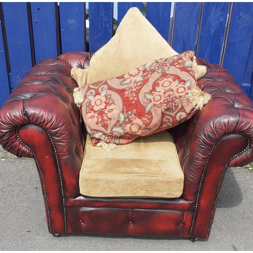 701 - A DEEP BUTTONED OXBLOOD CHESTERFIELD CHAIR