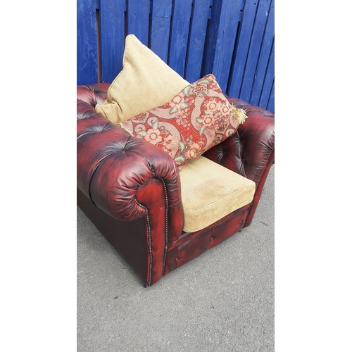 701 - A DEEP BUTTONED OXBLOOD CHESTERFIELD CHAIR