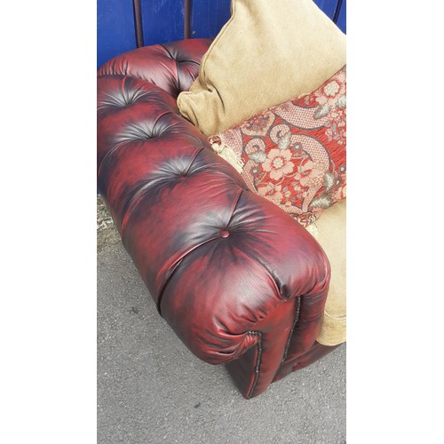 701 - A DEEP BUTTONED OXBLOOD CHESTERFIELD CHAIR