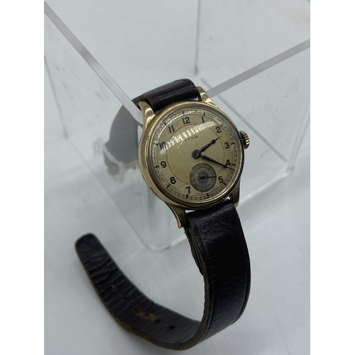 677 - A VINTAGE 9ct GOLD CYMA WATCH ON LEATHER STRAP