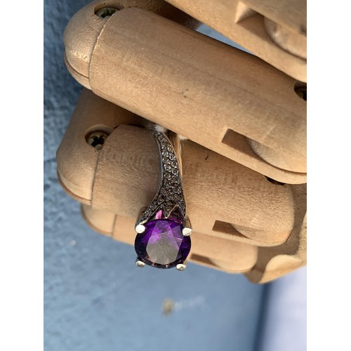 681 - AN AMETHYST AND DIAMOND RING OVAL AMETHYST 3CTS WEIGHT SET WITH FANCY DESIGN SHOULDERS WITH 25 BRILL... 