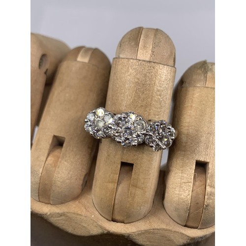 684 - STUNNING MULTI DIAMOND RING IN 18CT WHITE GOLD MAKES UP 3 DIASY STYLE PATTERNS