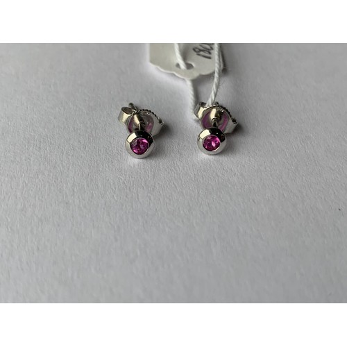 687 - RUBY BUTTON SHAPED SMALL EARRINGS IN 18CT WHITE GOLD STAMPED 750