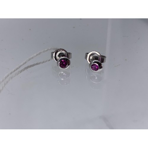 687 - RUBY BUTTON SHAPED SMALL EARRINGS IN 18CT WHITE GOLD STAMPED 750