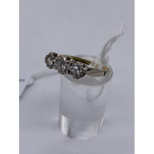 689 - A 3 STONE DIAMOND ILLUSION RING WITH 18ct GOLD STAMP AND PLATINUM SETTING TOTAL WEIGHT 3.9grms SIZE ... 