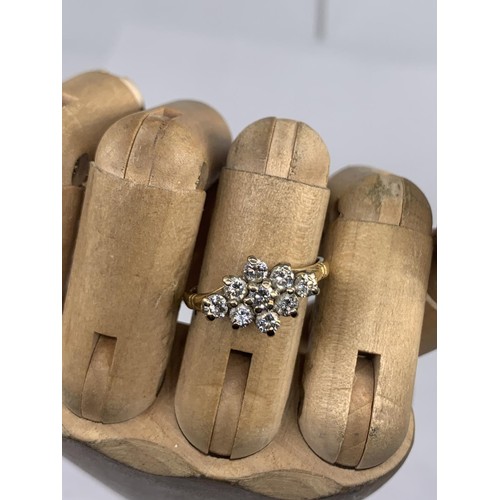 690 - STUNNING 18CT 9 STONE BOAT STYLE RING