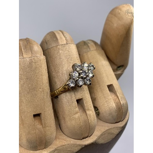 690 - STUNNING 18CT 9 STONE BOAT STYLE RING