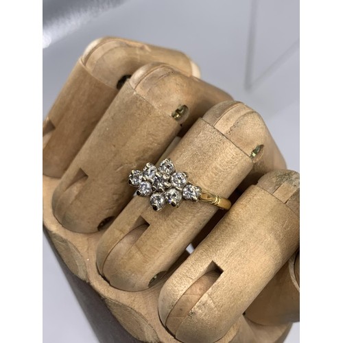 690 - STUNNING 18CT 9 STONE BOAT STYLE RING