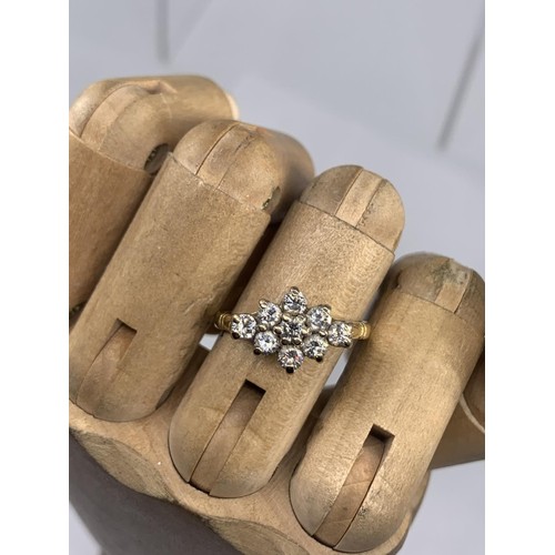 690 - STUNNING 18CT 9 STONE BOAT STYLE RING