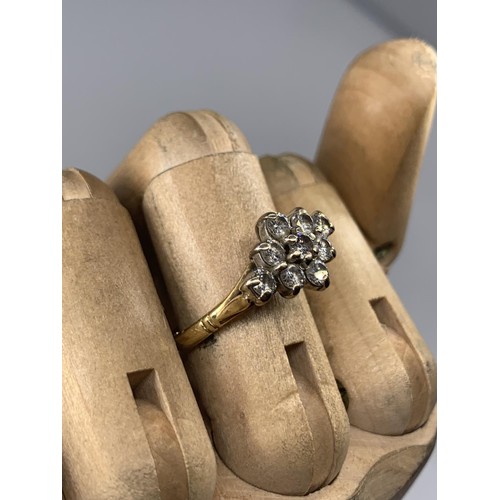 690 - STUNNING 18CT 9 STONE BOAT STYLE RING