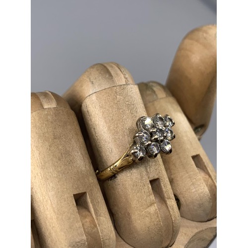 690 - STUNNING 18CT 9 STONE BOAT STYLE RING