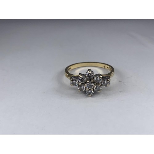 690 - STUNNING 18CT 9 STONE BOAT STYLE RING