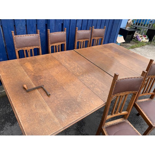 447 - ANTIQUE OAK EXTENDING TABLE WITH 2 EXTRA LEAVES & 6 OAK ARTS & CRAFTS CHAIRS