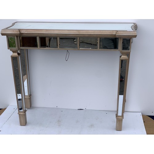 463 - A MULTI PANELLED MIRRORED HALL TABLE 39X15.5X31