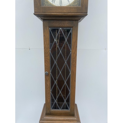 535 - A TRIPLE WEIGHT CARVED OAK GRANDFATHER CLOCK